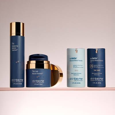 Three skinbetter science products lined up horizontally on a pale grey surface